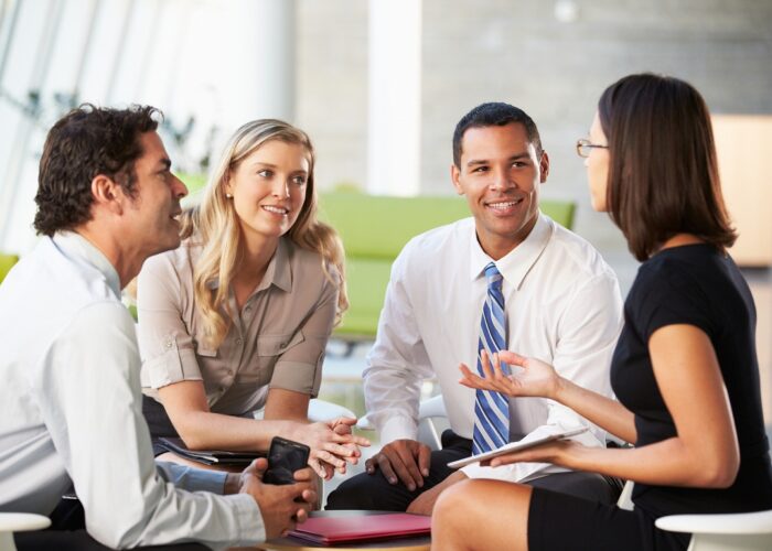 Businesspeople With Digital Tablet Having Meeting In Office Businesspeople With Digital Tablet Having Meeting In Office